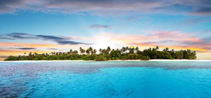 Beautiful nonsettled tropical island in sunset